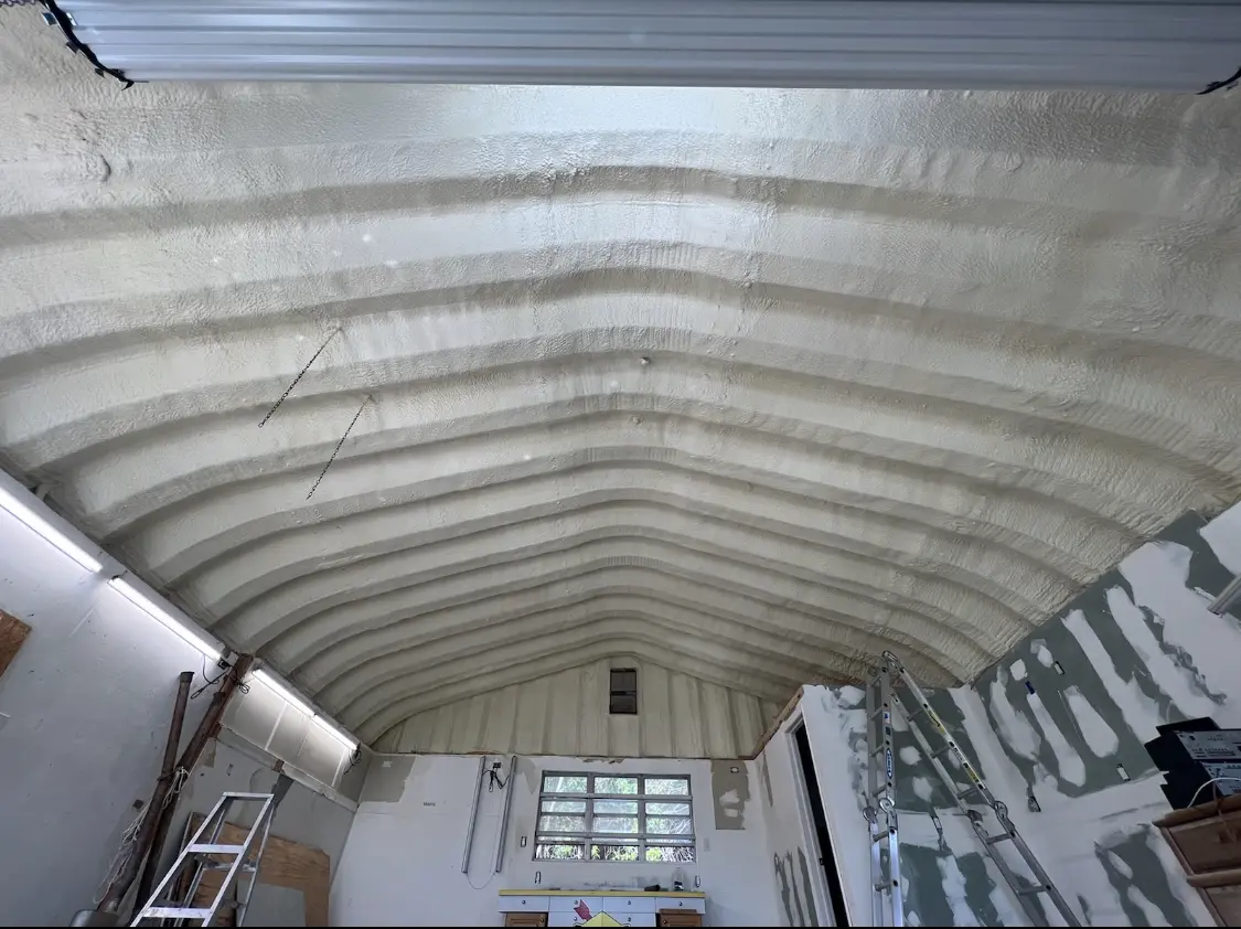 Spray polyurethane foam applied to the underside of a metal roof deck in Santa Clara